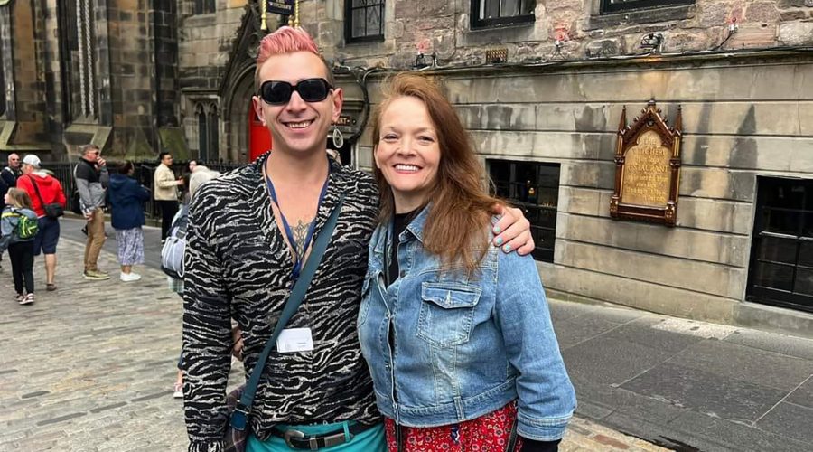 A man and a woman posing for a photo in Edinburgh.
