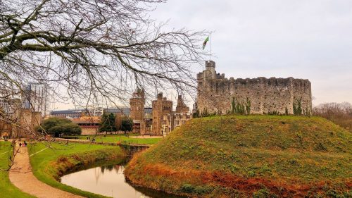 Visit a castle on a hill next to a river in the UK.
