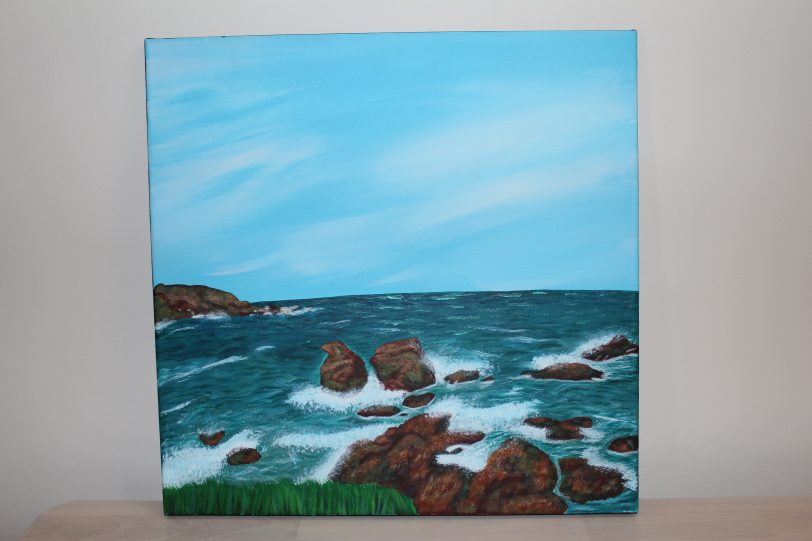 A stunning painting of the ocean, featuring majestic rocks on its serene surface. This captivating artwork presents a unique opportunity to support Invisible Cities and participate in a special auction.